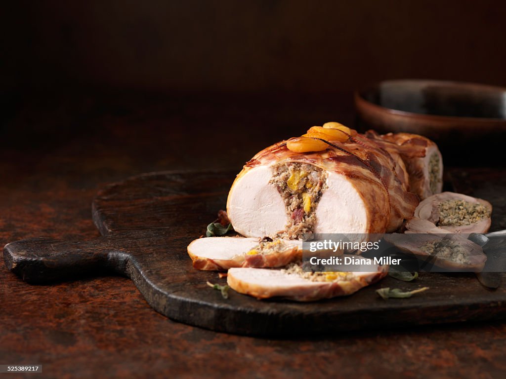 Christmas dinner. Boneless double stuffed turkey with sage, apricots and bacon