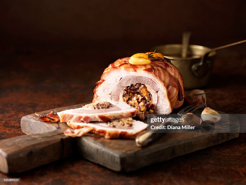 Christmas dinner. Three bird roast with garlic rosemary, apricot and bacon