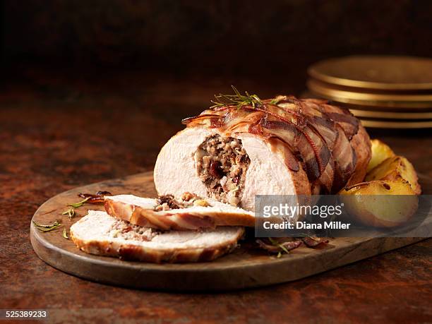 christmas dinner. turkey breast with pork, apple & cranberry stuffing and rosemary - apple plate stock pictures, royalty-free photos & images
