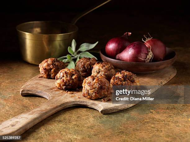 festive christmas ingredients of pork, caramelized red onion with sage and red onion - meatball fotografías e imágenes de stock