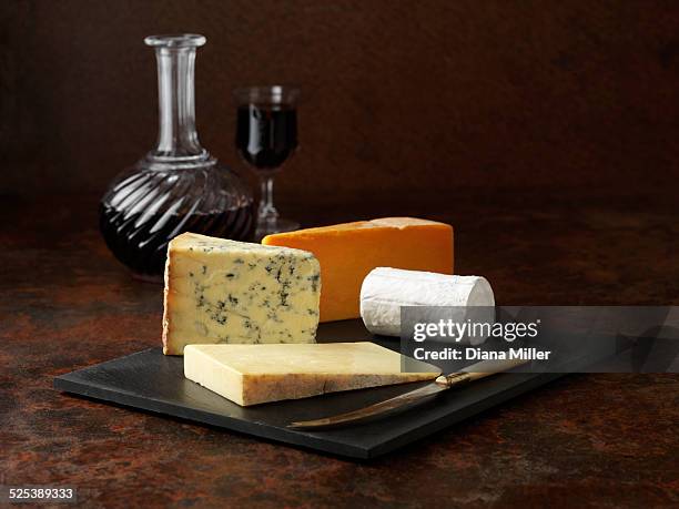 cheese board with red wine - cheese board stock pictures, royalty-free photos & images