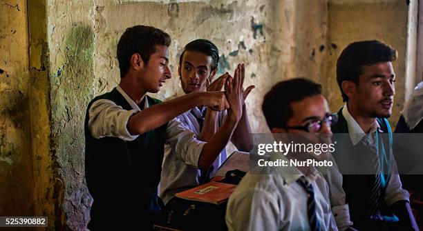 Deaf and dumb students gesture with the help of signs as they learn at Abhedananda Home, a school for deaf, dumb and blind students on on September...