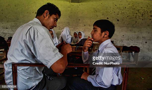 Deaf and dumb students communicate with the help of signs at Abhedananda Home, a school for deaf, dumb and blind students on on September 01, 2015 in...