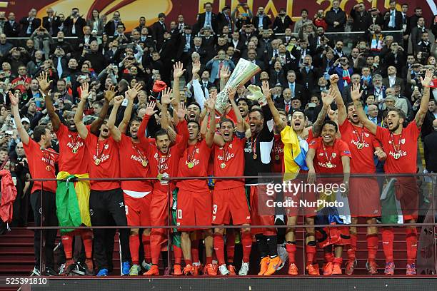 Sevilla players celebrate with the trophy at the end of the UEFA Europa league final football match between FC Dnipro Dnipropetrovsk and Sevilla FC...