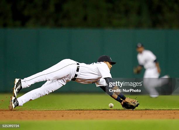 Detroit Tigers' Dixon Machado could not catch the ball after diving for a ball off the bat of Minnesota twins' Miguel Sano during the third inning of...