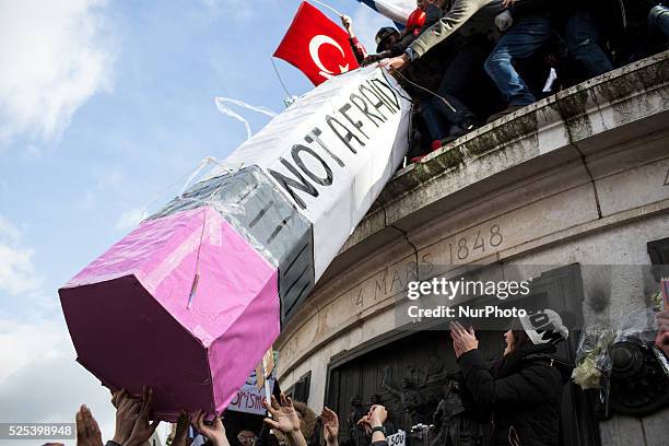 People holding cardboards reading &quot;Je suis Charlie take part in a Unity rally "Marche Republicaine" on the Place de la Republique in Paris on on...