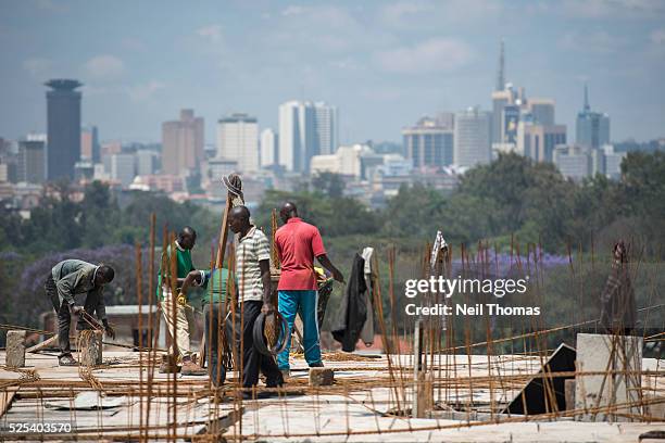 Construction workers in the Somali slum of Eastleigh overlook Nairobi's business district.