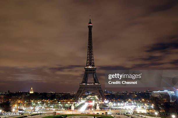 The Eiffel Tower is seen after the lights are turned off during Earth Hour 2015, on March 28, 2015 in Paris, France. According to organisers the...