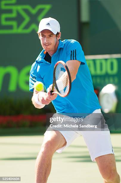 Andy Murray returns a backhand against Novak Djokovic of Serbia during their match on Day 10