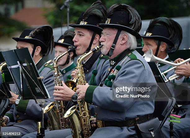 Members of Tiroler Kaiserj��germusik band perform in Krakow Main Square as over 400 persons from Trentino-Alto Adige/S��dtirol region, related to...