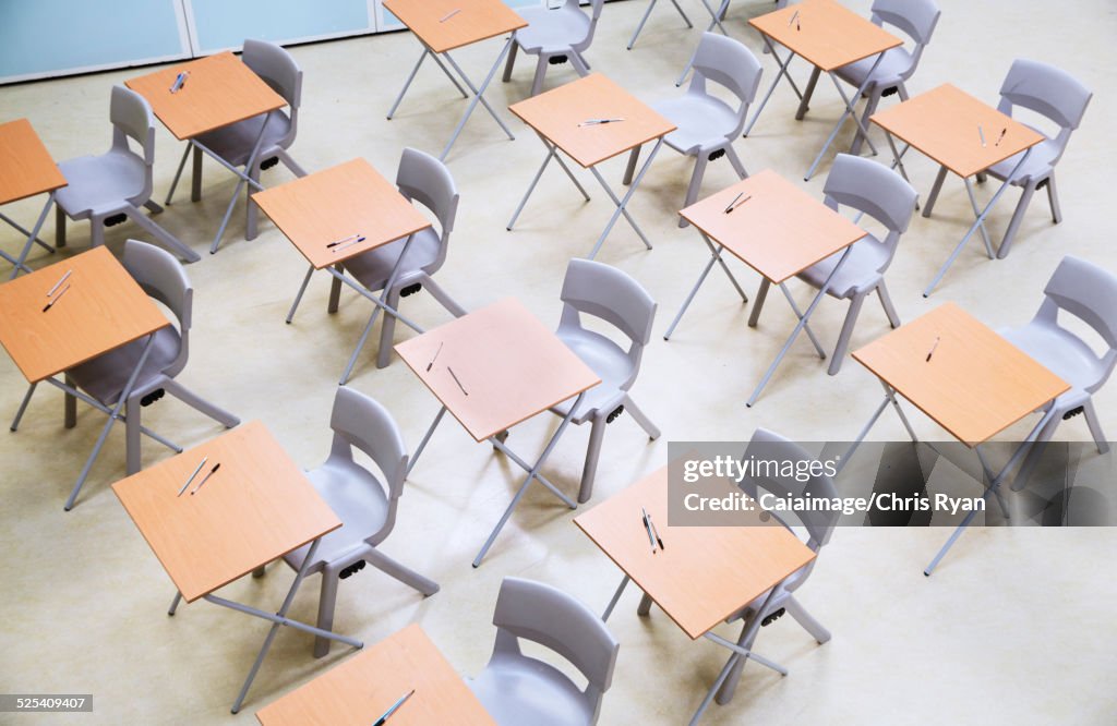 Elevated view of rows of desks and chairs in empty classroom