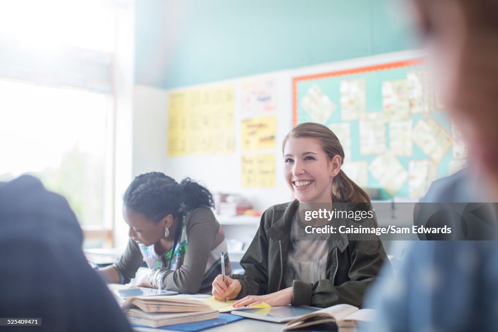 Teenage students learning in classroom