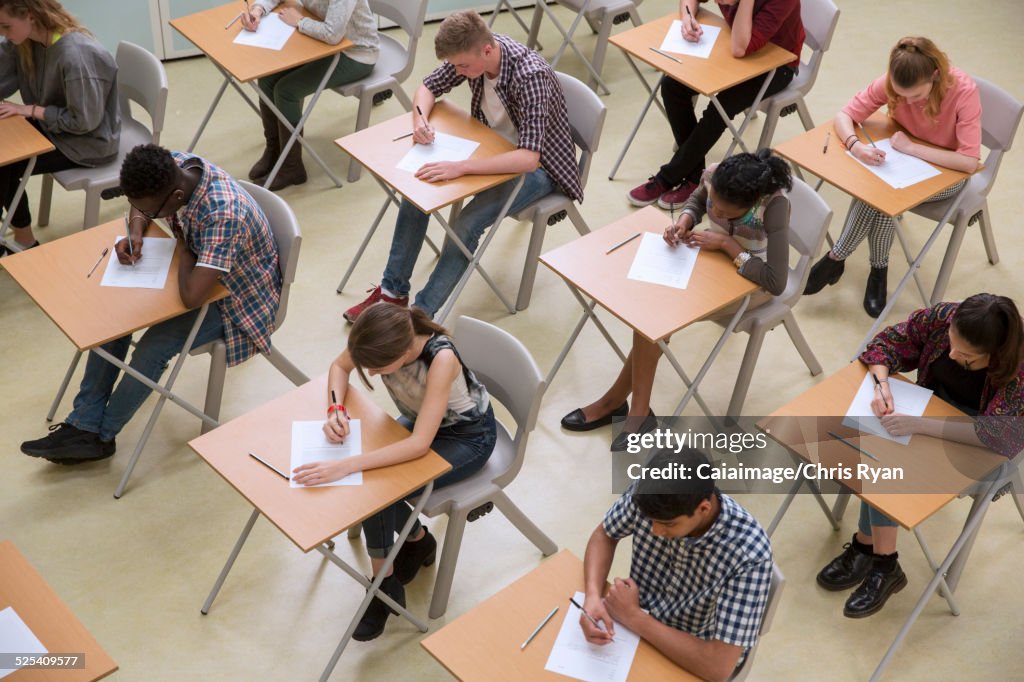 Elevated view of students writing their GCSE exam