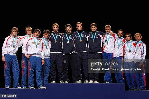 Laurence Halsted, Edward Jefferies, Jamie Kenber and Richard Kruse pose with their gold medals after winning the Men's Foil Team Event at the Fencing...