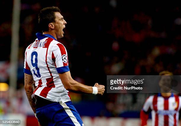 Atletico de Madrid's Croatian forward Mario Mandzukic Celebrates a goal during the Champions League 2014/15 match between Atletico de Madrid and...