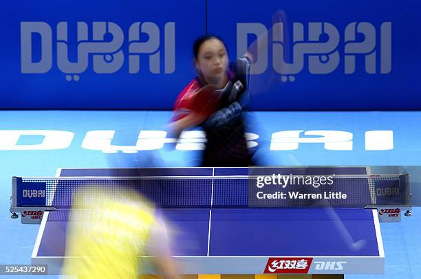 Mima Ito of Japan in action against Feng Tianwei of Singapore during day one of the Nakheel Table Tennis Asian Cup 2016 at Dubai World Trade Centre...