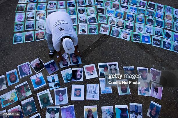 An displays the portraits of the missing migrants during a protest of the caravan of mothers of Central American migrants in Tapachula Chiapas,...