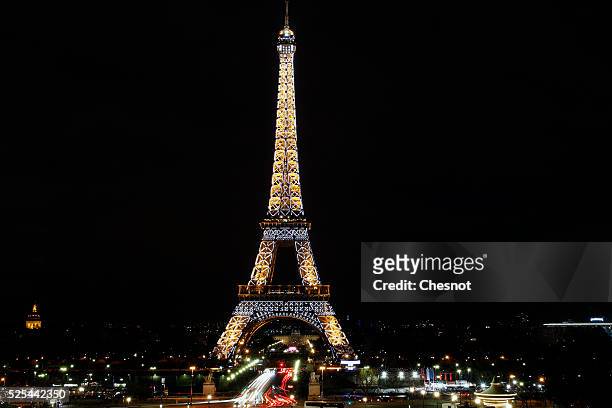 The Eiffel Tower is seen prior the lights are turned off during Earth Hour 2015, on March 28, 2015 in Paris, France. According to organizers the...