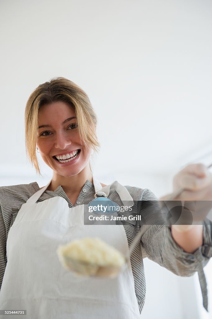 USA, New Jersey, Jersey City, Portrait of charity volunteer holding food
