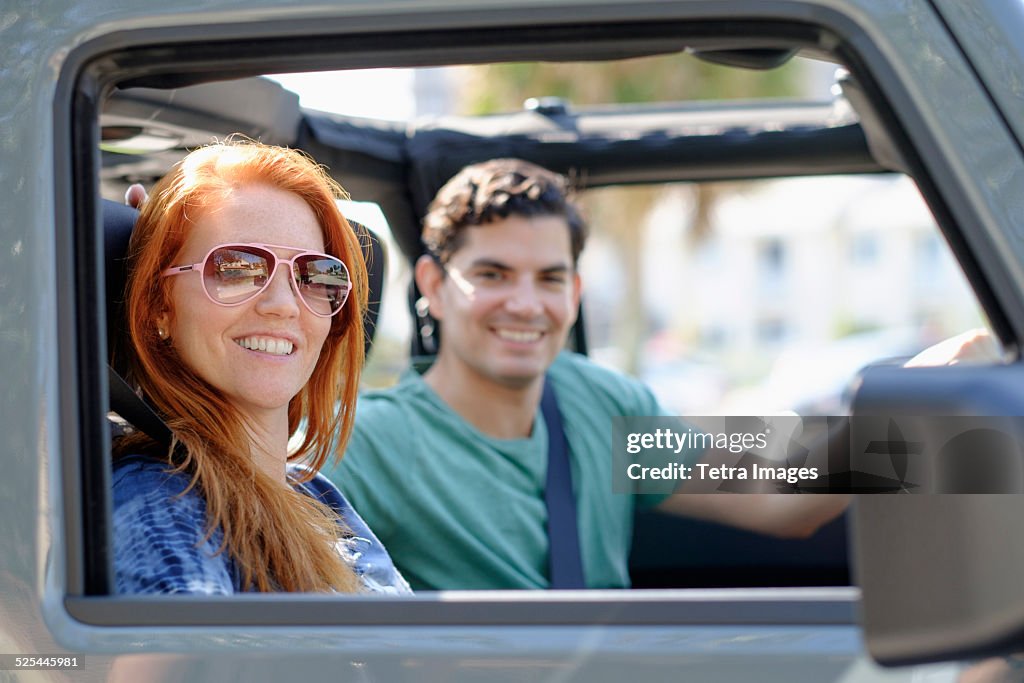 USA, Florida, Palm Beach, Portrait of couple sitting in car