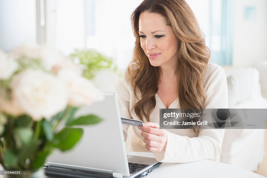 USA, New Jersey, Jersey City, Woman doing online shopping on laptop