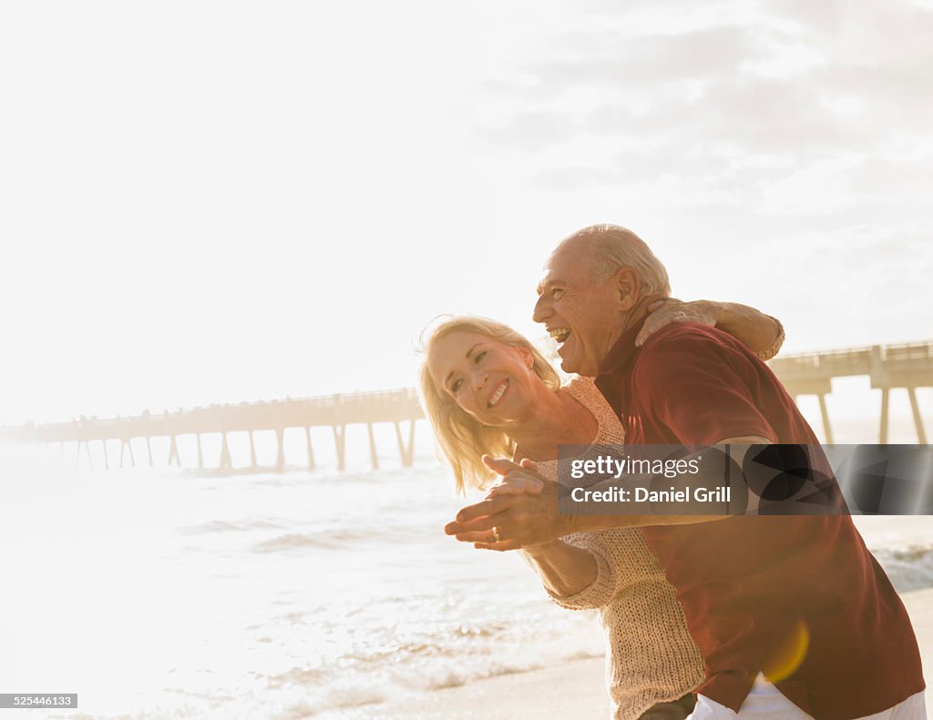 USA, Florida, Jupiter, Senior couple dancing on beach