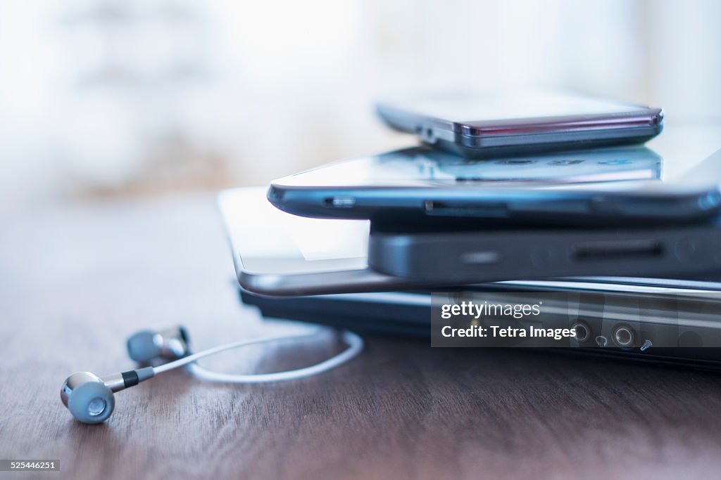 USA, New Jersey, Jersey City, Close up of stack of devices on desk
