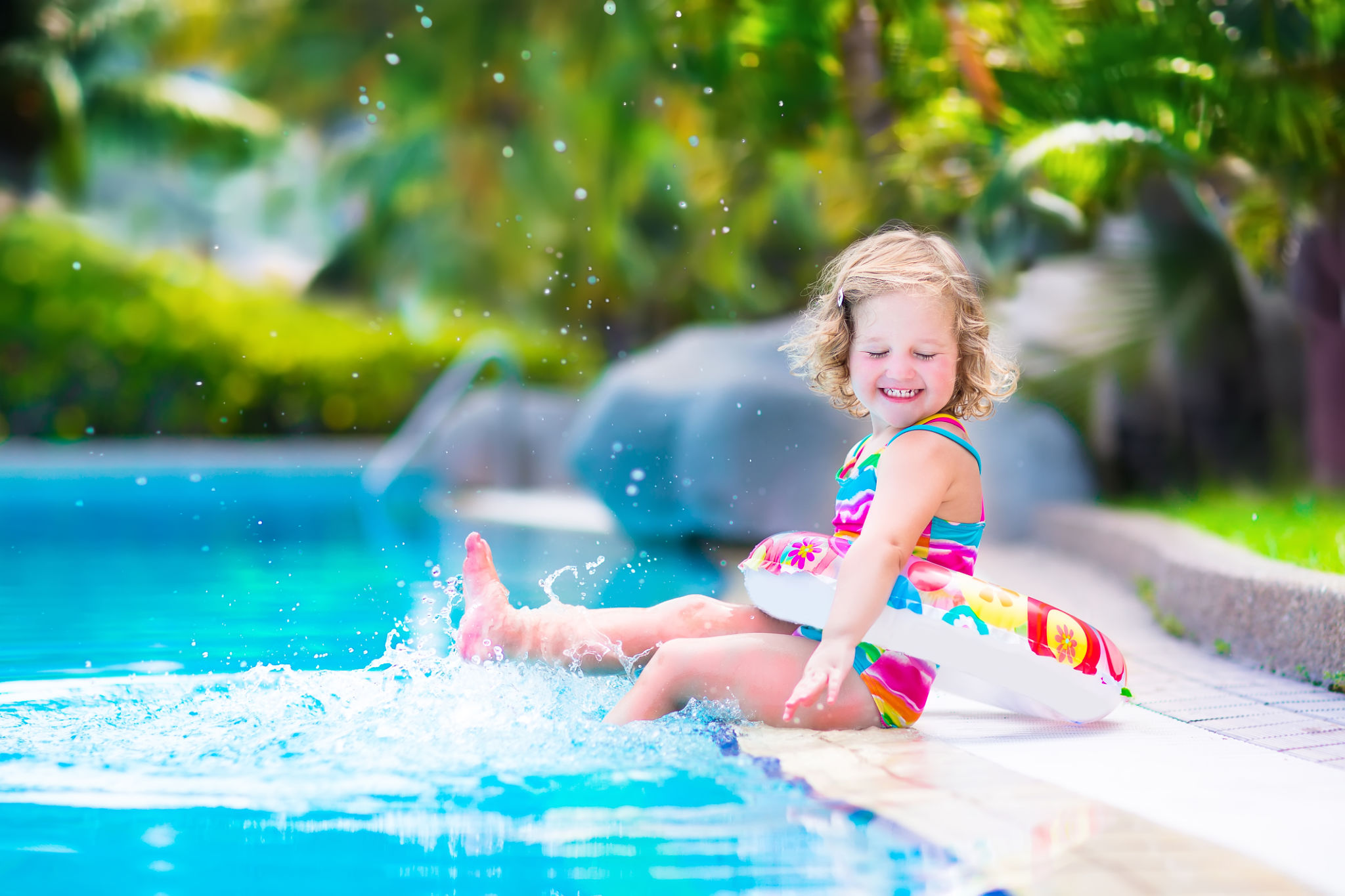 Little happy girl in a swimming pool Little happy girl in a swimming pool