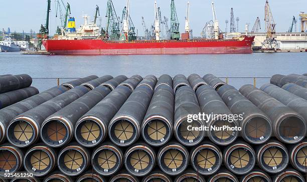 Workers arrange pipes delivered for construction of the South Stream gas pipeline at the Black sea harbour of Varna some 450 kms east of the...