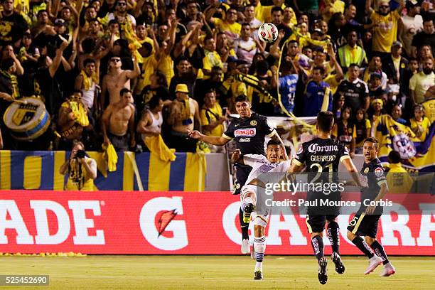 Jose Villarreal of the Los Angeles Galaxy goes up for a header against a of Club America opponent during the Los Angeles Galaxy vs Club America match...