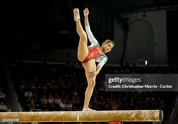 Yanin Hernandez of Mexico tries to hold her balance on the beam during the women's artistic gymnastics team final and qualifications competition at...