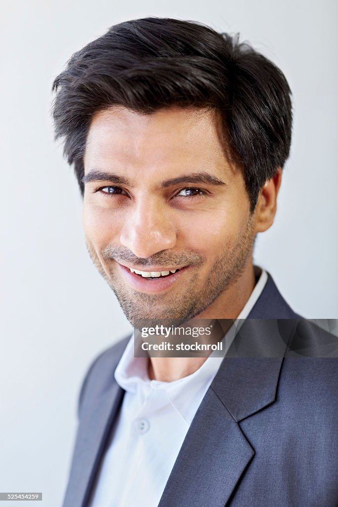 Cheerful young Indian businessman