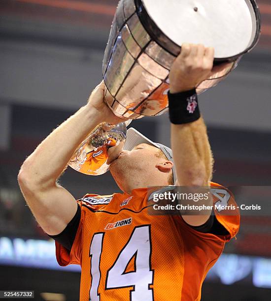 The BC Lions quarterback Travis Lulay kisses the Grey Cup after the Lions defeated the Winnipeg Blue Bombers 34-23 at the Canadian Football League...