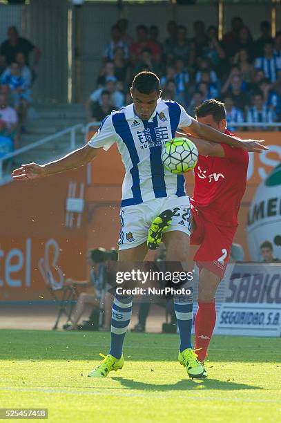 Jonathas of Real Sociedad vies with Luis Hernandez during the Spanish league football match Real Sociedad vs Sporting Gijon at the Anoeta Stadium in...