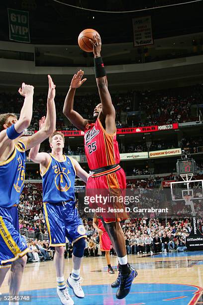 Marc Jackson of the Philadelphia 76ers shoots in the lane against Andris Biedrins of the Golden State Warriors during the game on March 8, 2005 at...
