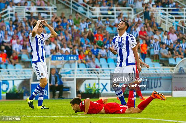Carlos Vela and Ruben Pardo of Real Sociedad reacts during the Spanish league football match Real Sociedad vs Sporting Gijon at the Anoeta Stadium in...