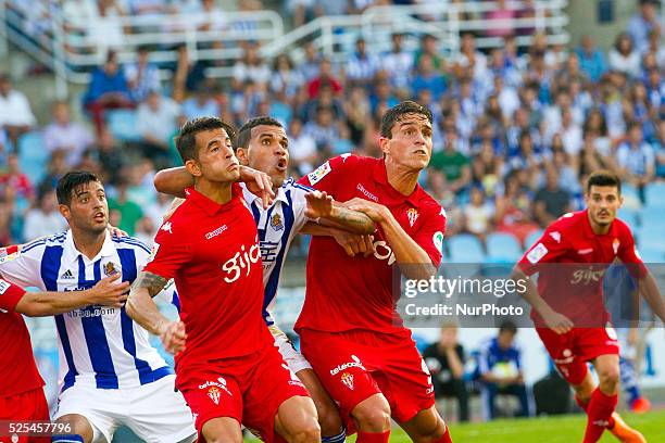 Jonathas of Real Sociedad duels for the ball with Luis Hernandez and Guerrero of Sporting Gijon during the Spanish league football match Real...