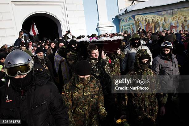 Tens of thousands of people walk a mourning during the funeral procession of the activist Mikhail Zhiznevsky, in Kiev, on Jan. 26, 2014 which was...