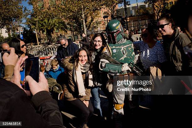 People dressed as characters from the film series Star Wars poses for photographs in Barcelona, Spain during a meeting of Star Wars fans on 29...