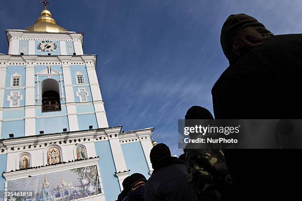 Tens of thousands of people walk a mourning during the funeral procession of the activist Mikhail Zhiznevsky, in Kiev, on Jan. 26, 2014 which was...