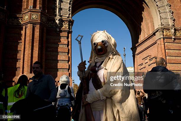 Man dressed as a character from the film series Star Wars poses for photographs in Barcelona, Spain during a meeting of Star Wars fans on 29 November...