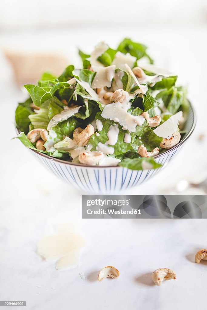 Caesar Salad with roasted cashews in a bowl