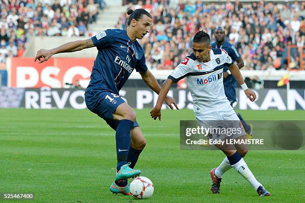 Zlatan Ibrahimovic of PSG vies for the ball with Ryad Boudebouz of Sochaux during the French Ligue 1 soccer match, Paris Saint Germain vs FC Sochaux...