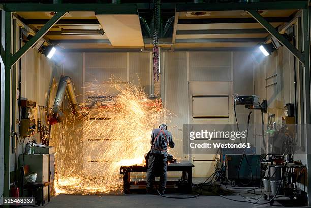 welder working in a factory - 溶接する ストックフォトと画像