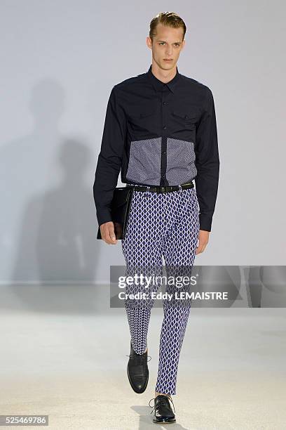 Model presents a creation from the Spring/Summer 2012/2013 Men's collection of Wooyoungmi at the Paris Fashion Week, in Paris, France, 30 June 2012....