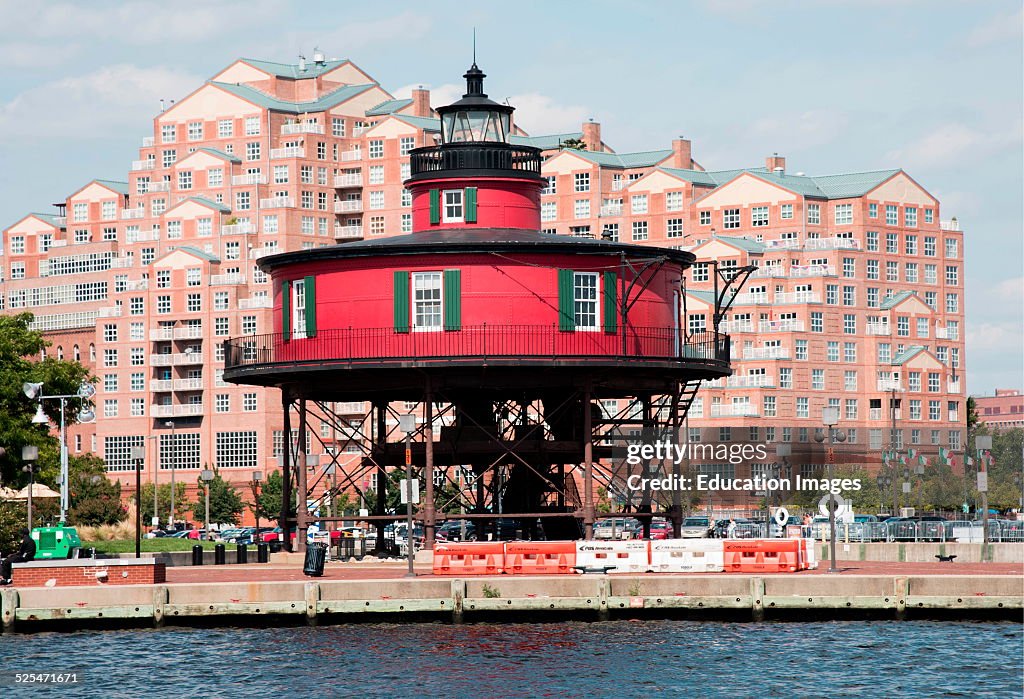 Seven Foot Knoll lighthouse dwarfed by high rise apartment building, Baltimore, Maryland