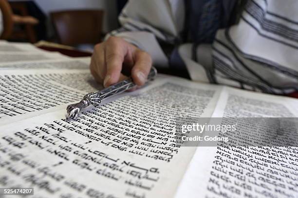 Jewish torah scroll with pointer.