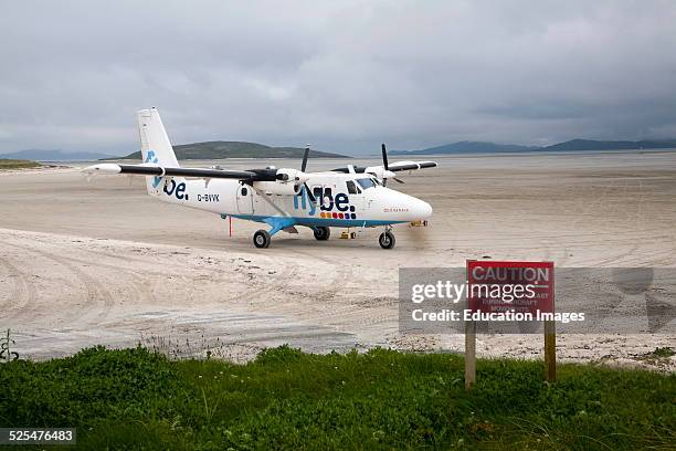 Flybe plane on sandy airstrip Isle of Barra airport, Outer Hebrides, Scotland.