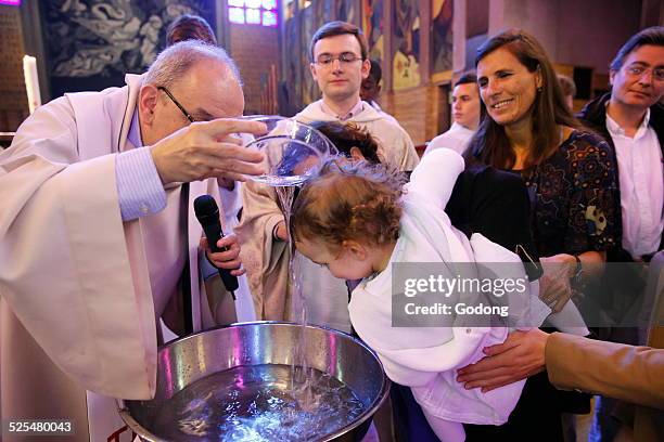 Mass of the sacraments at St Joan of Arcs school in Montrouge, Baptism.