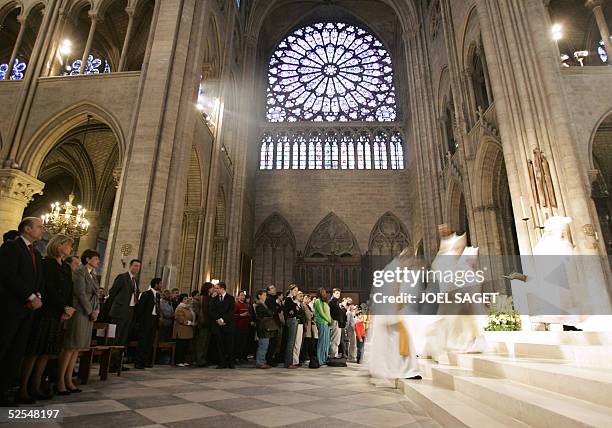 Former French Prime Minister Alain Juppe attends with Isabelle Barnier, French Foreign Minister's wife and Anne-Marie Raffarin, French Prime...